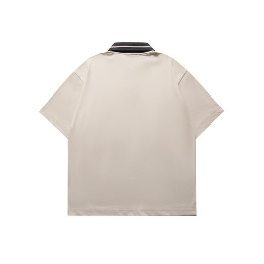 Polo holgado con diseño de cuello en contraste y estampado de letras