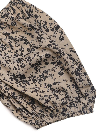 Mono de lunares con mangas abullonadas, cuello cuadrado, cintura elástica y pantalones