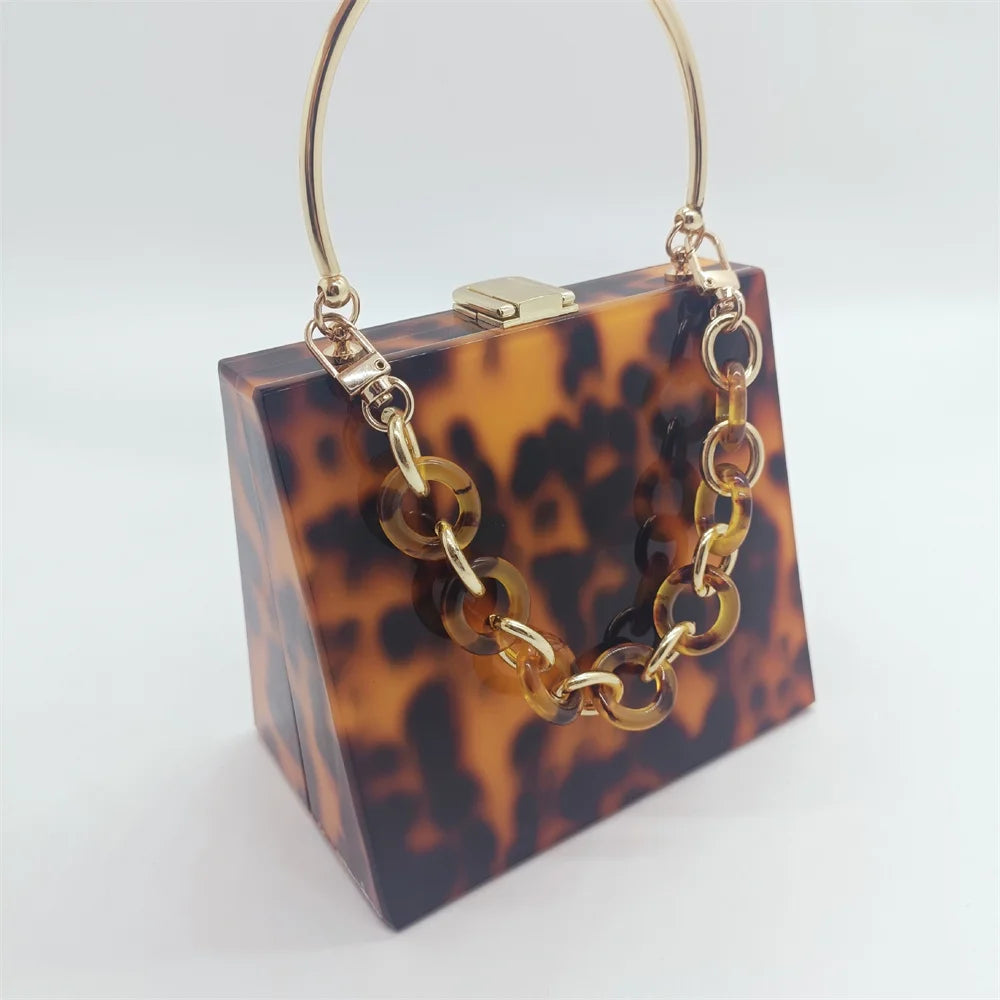 Bolso - monedero de mano de acrílico con estampado de leopardo con asa de metal