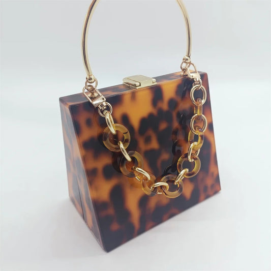 Bolso - monedero de mano de acrílico con estampado de leopardo con asa de metal