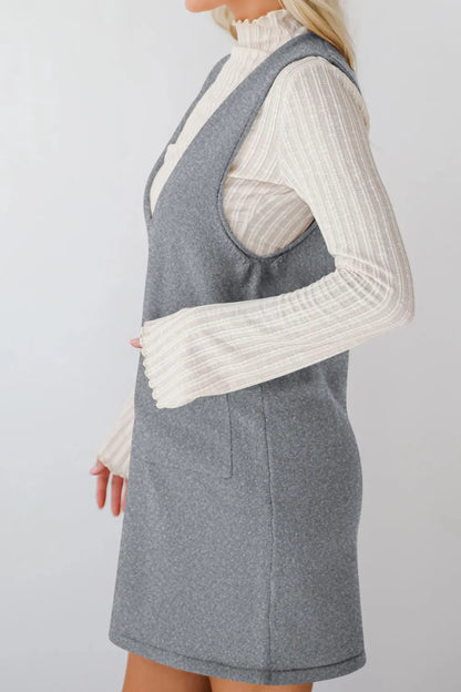 Vestido tipo jersey mini con cuello en V