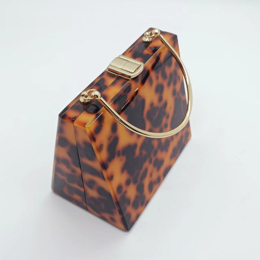 Bolso - monedero de mano de acrílico con estampado de leopardo con asa de metal